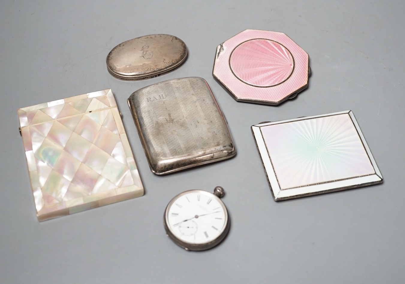 A 1920's silver and enamelled cigarette case, a 1930's silver and enamelled compact, a silver cigarette case, silver lid, silver pocket watch and a mother of pearl card case.